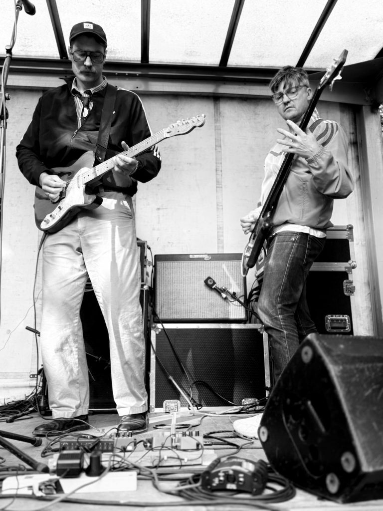 Stan fronting on guitar and Ben M on Basse